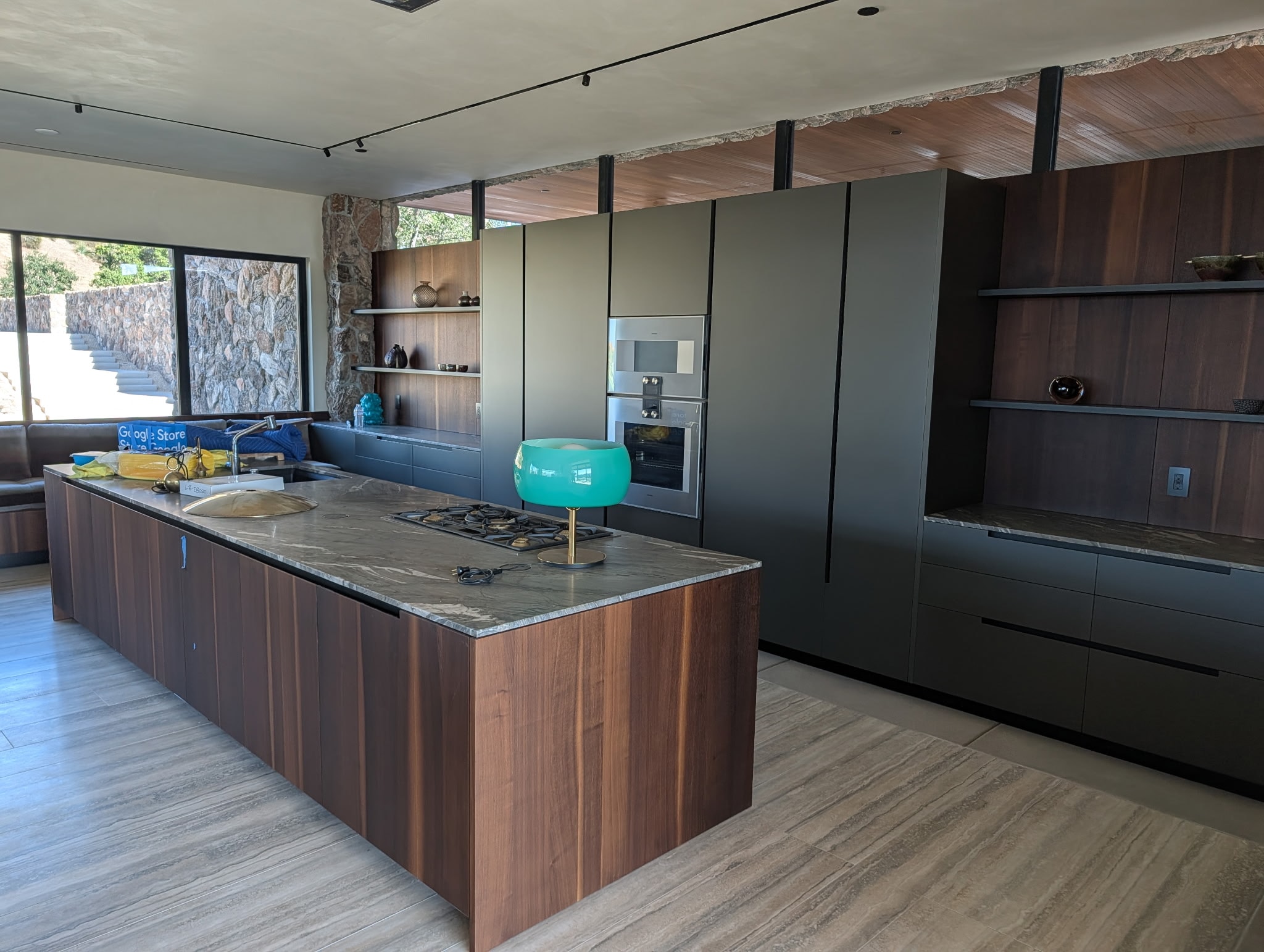 Baja Drift thin veneer — Malibu modern kitchen with stone feature wall