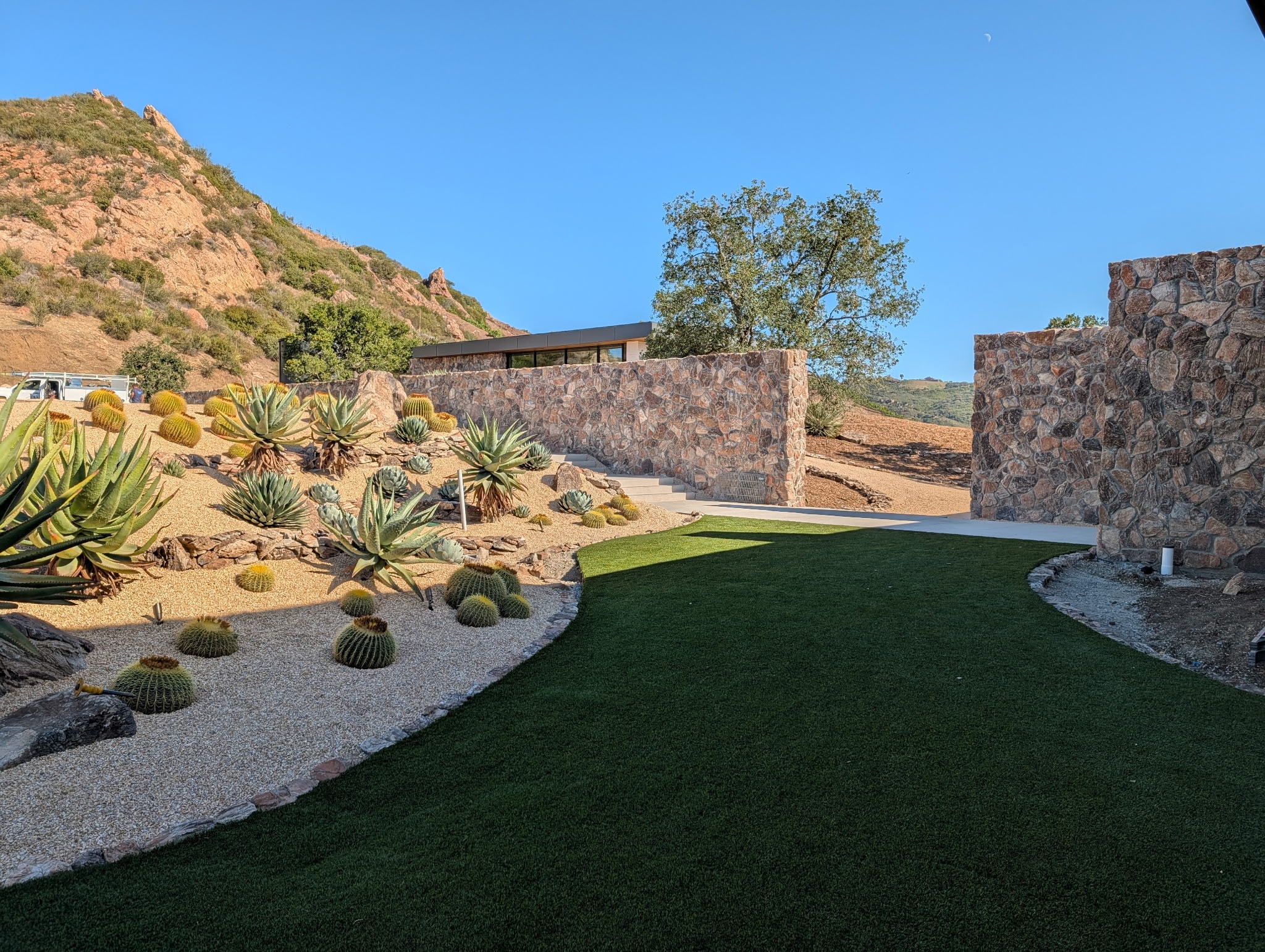 Baja Drift thin veneer — Malibu desert landscape with stone walls and cactus garden