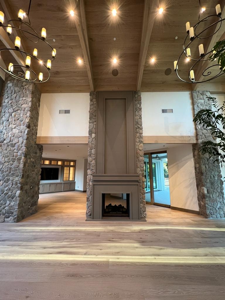 Mexican River Rock — luxury interior stone columns and fireplace